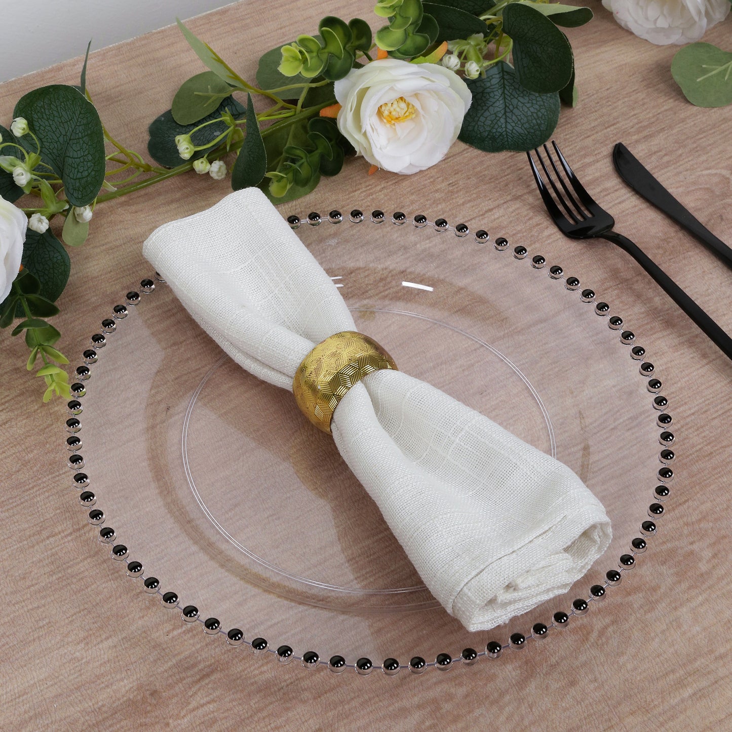 Clear disposable dinner plate with black beaded rim, elegant for parties.