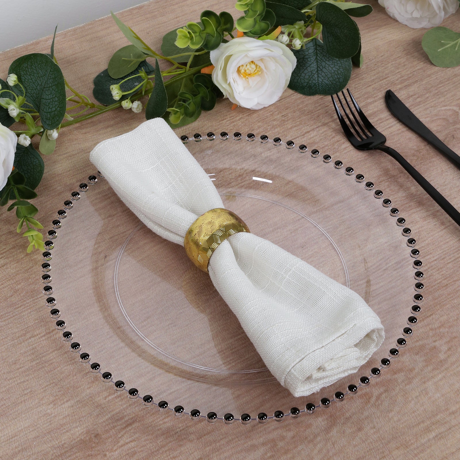 Clear disposable dinner plate with black beaded rim, elegant for parties.