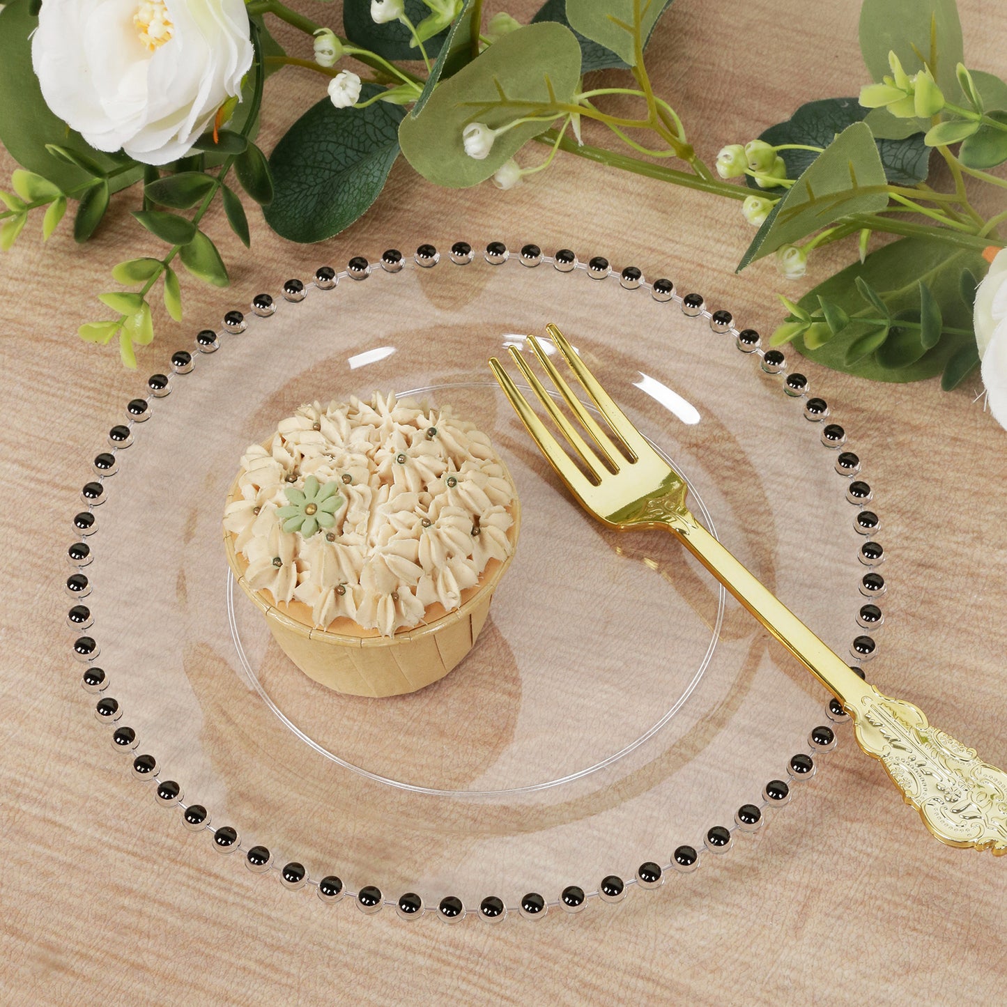 Clear plastic dessert plate with black beaded rim, featuring a cupcake.