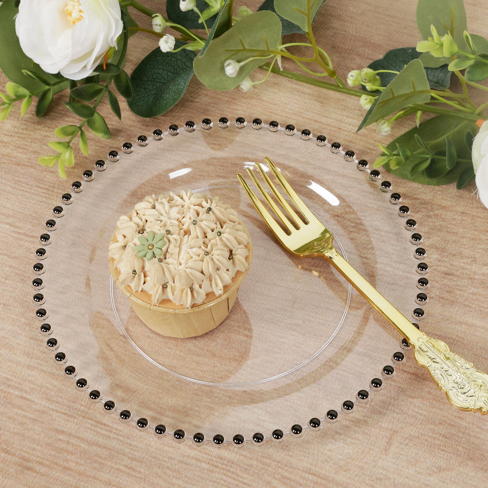Clear plastic dessert plate with black beaded rim, featuring a cupcake.