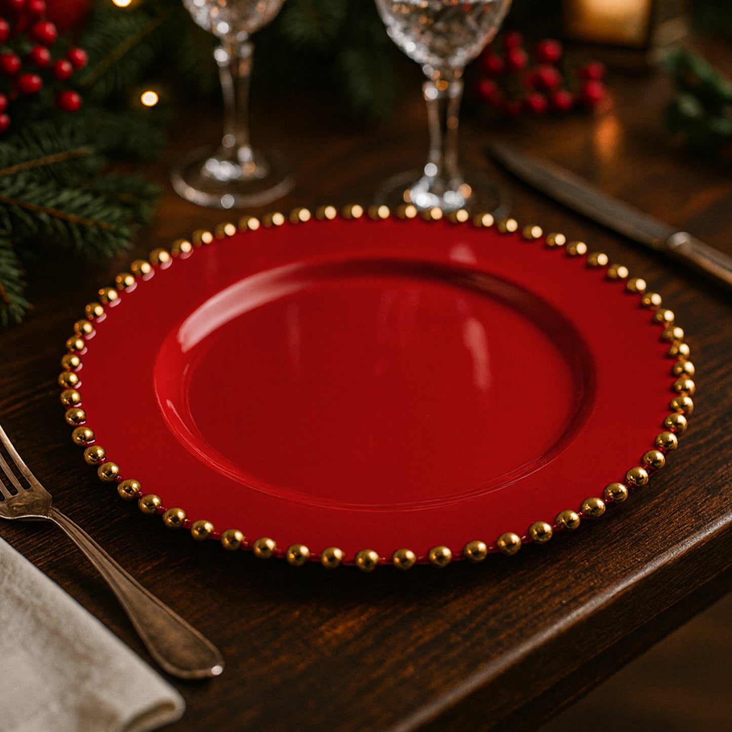 Red plastic dessert plate with gold beaded rim for parties.