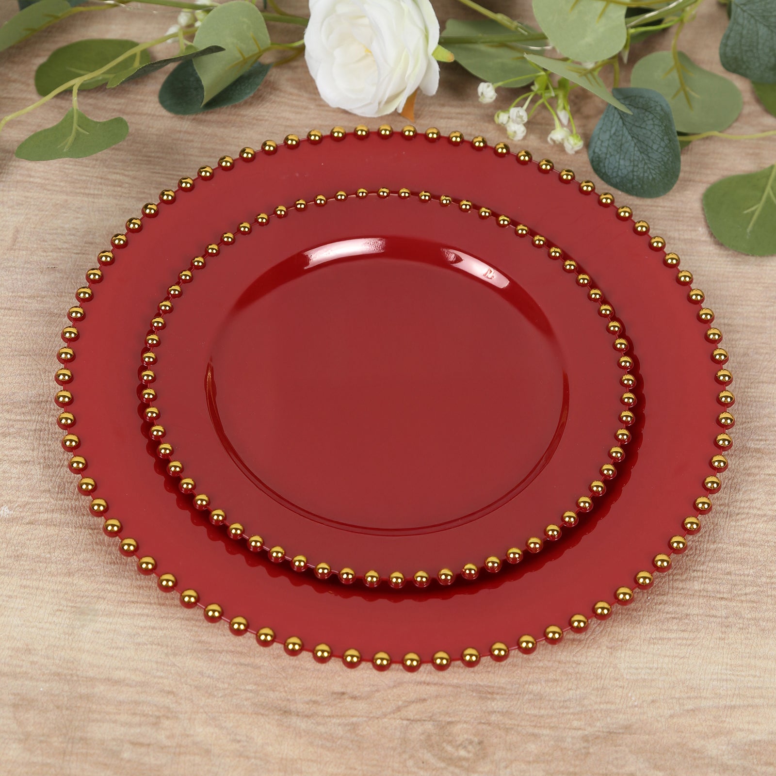 Red plastic dessert plates with gold beaded rim, perfect for parties and events.