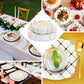 White and gold disposable square dinner plates in a geometric design.