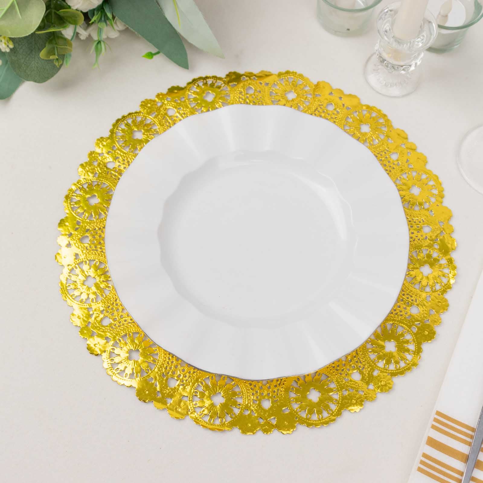 Metallic gold lace doily placemat with a white plate on top.