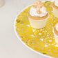 Metallic gold paper lace doilies on a cake stand with cupcakes.