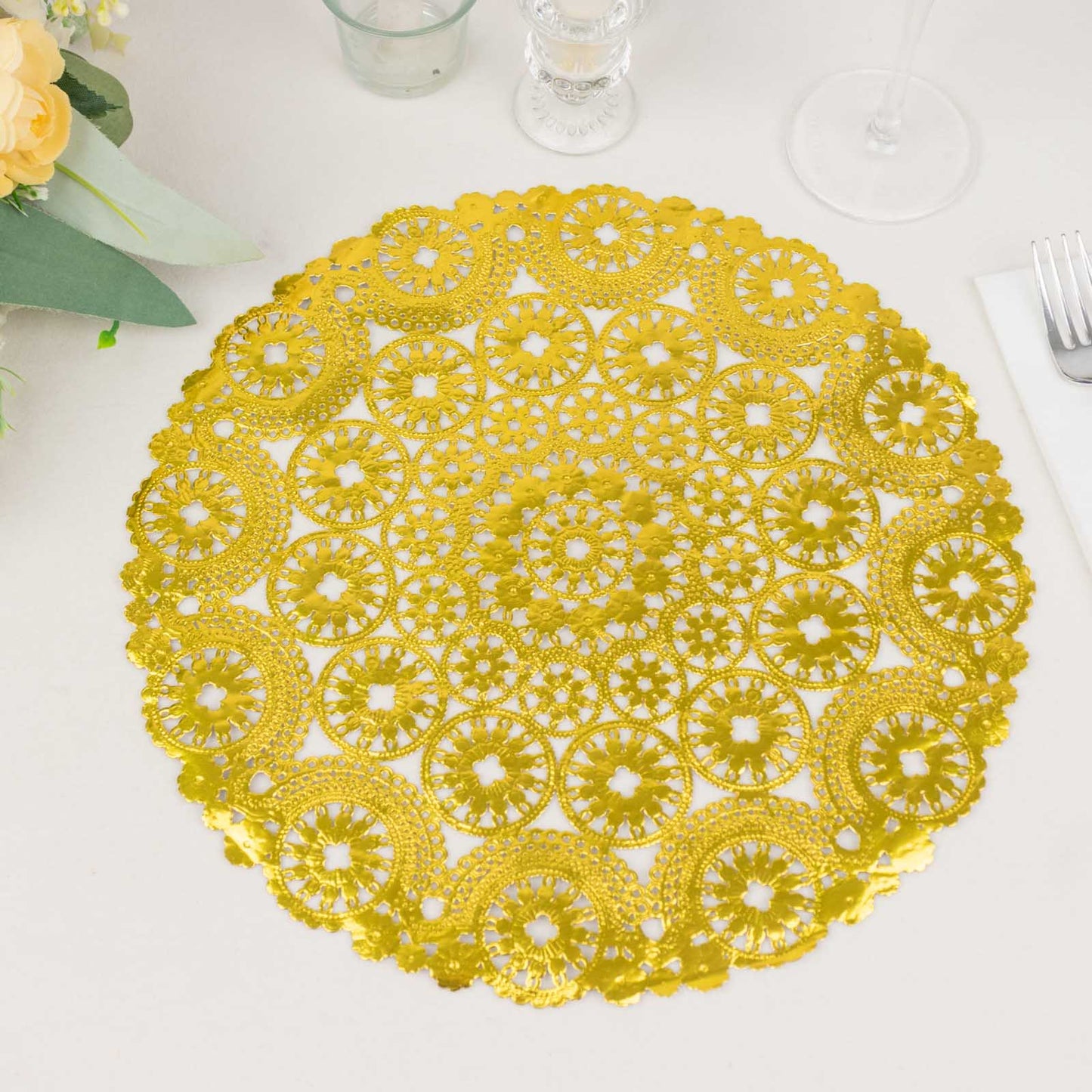 Metallic gold round lace doily placemat, 12 inches in diameter.