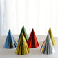 Mixed metallic foil party hats in various colors including red, green, and gold.