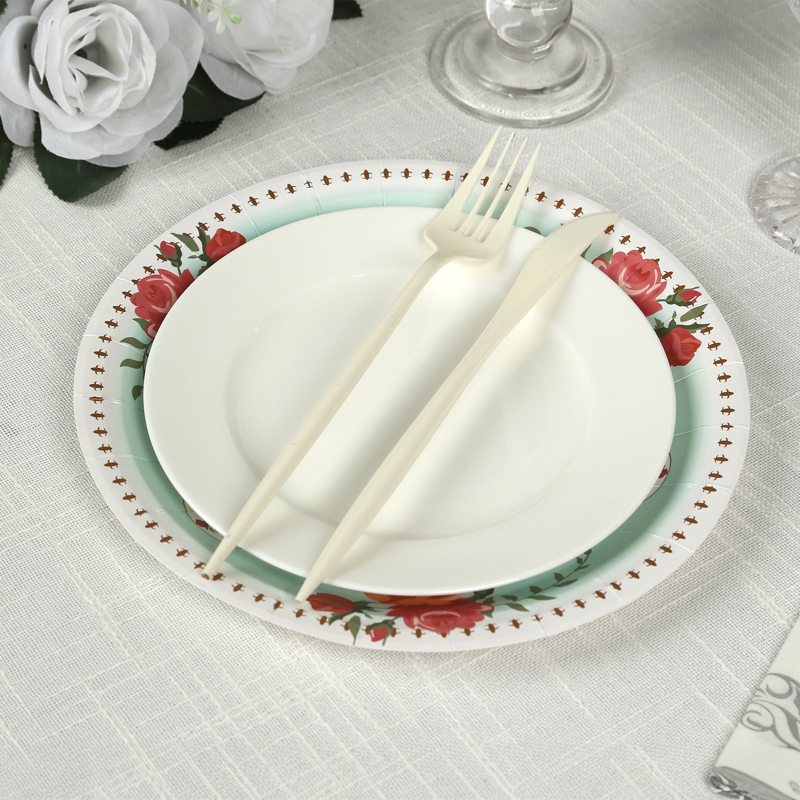 Light turquoise floral paper dinner plate with rose flowers print.