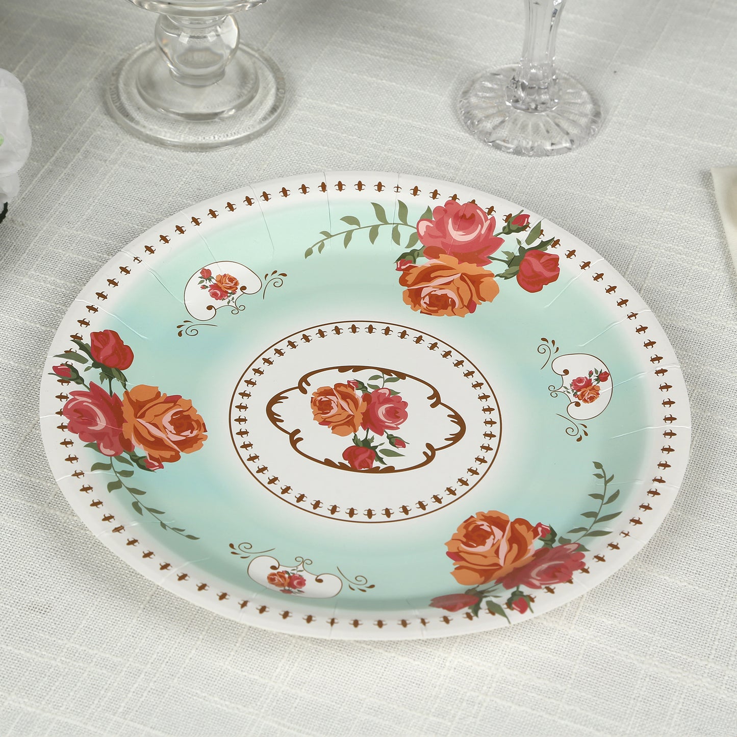 Light turquoise floral paper dinner plate with rose print.