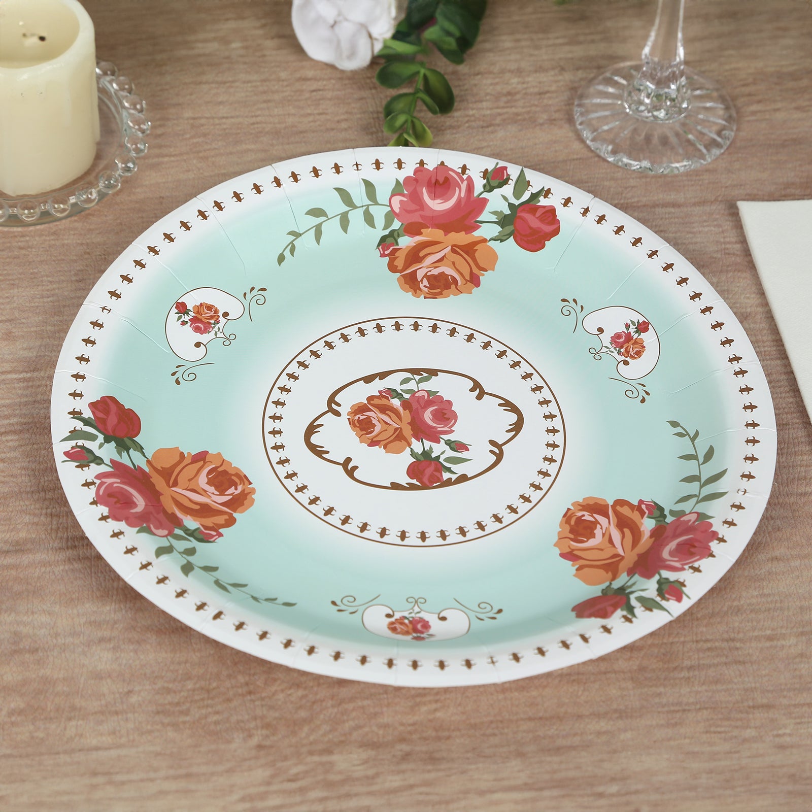 Light turquoise floral paper dinner plate with rose flowers print.