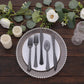 Transparent black disposable plastic cutlery set on a decorative plate.
