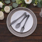 Transparent black disposable cutlery set on a plate with floral decor.