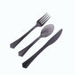 Transparent black disposable cutlery set with flared handles.