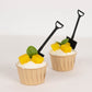 Black mini shovel spoons in dessert cups with mango and mint garnish.