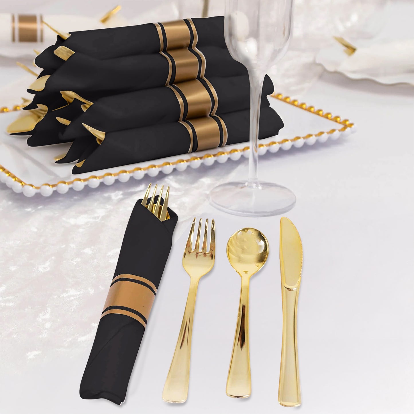 Gold disposable cutlery set with black paper napkins, elegantly arranged.
