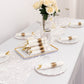Gold disposable cutlery set with white napkins on a festive table setting.
