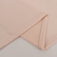 Blush 4-way stretch spandex fabric roll, perfect for DIY crafts.
