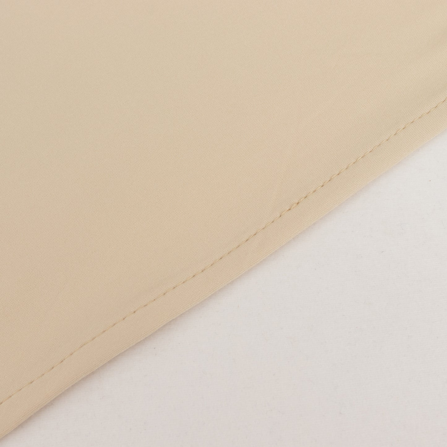 Beige spandex 4-way stretch fabric roll, perfect for DIY crafts.