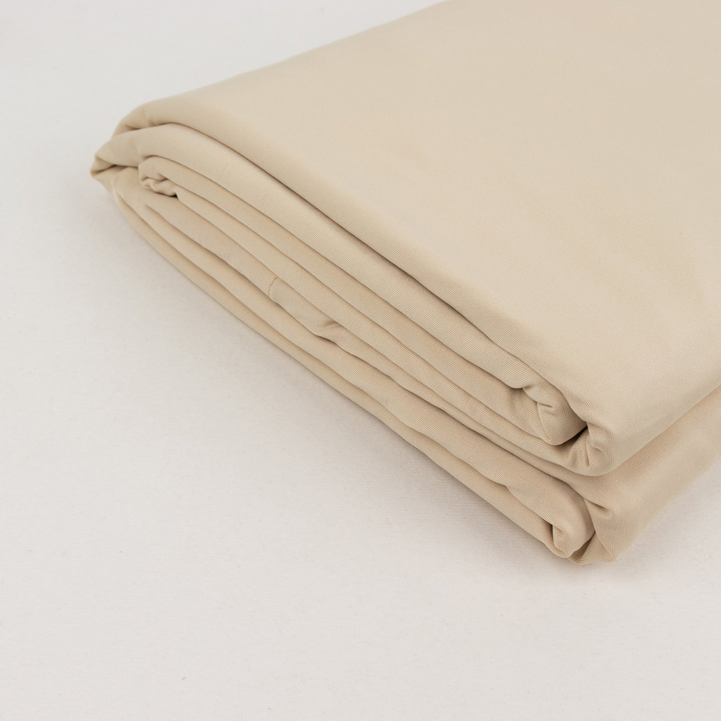 Beige spandex 4-way stretch fabric roll, 60"x10 yards, perfect for DIY crafts.