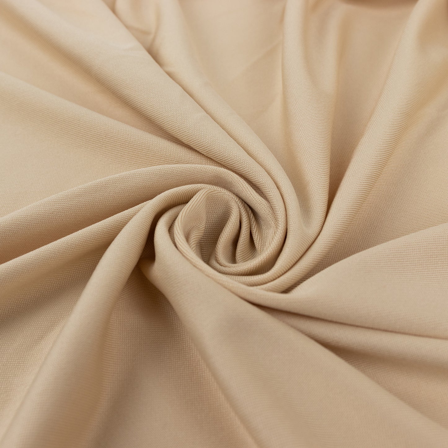 Beige 4-way stretch spandex fabric roll, perfect for DIY crafts.