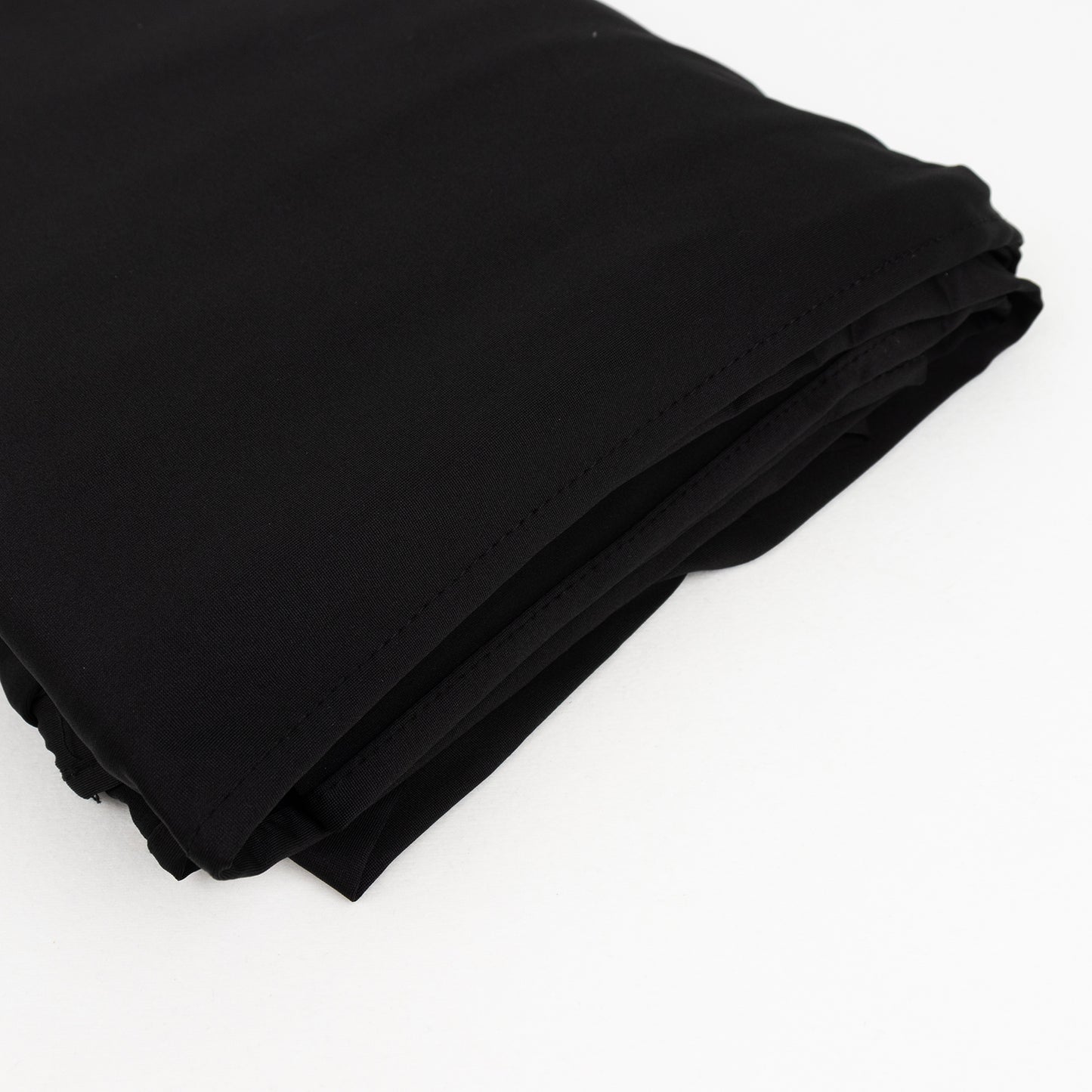 Black spandex 4-way stretch fabric roll, perfect for DIY crafts.