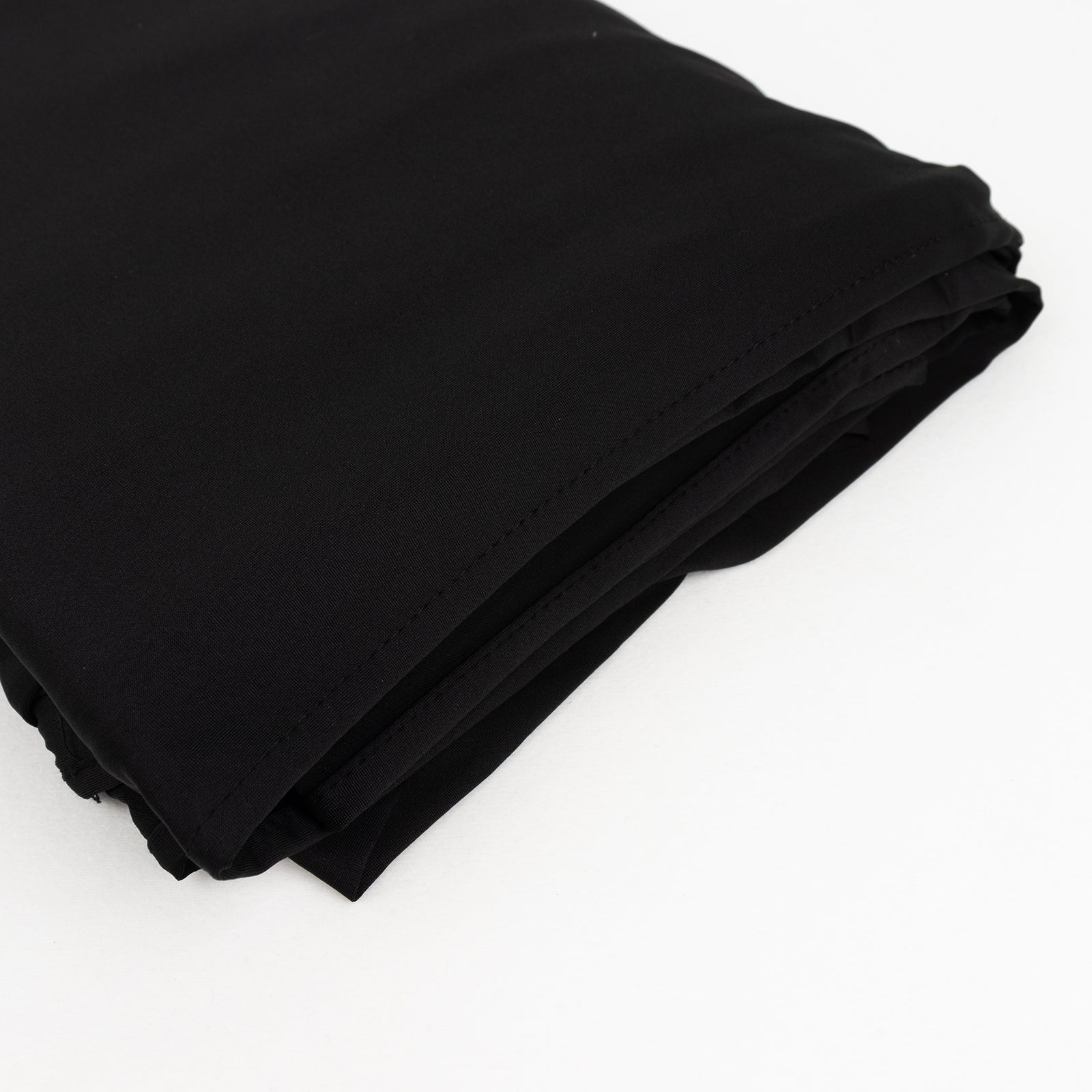 Black spandex 4-way stretch fabric roll, perfect for DIY crafts.