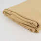 Champagne spandex 4-way stretch fabric roll, 60"x10 yards, folded.