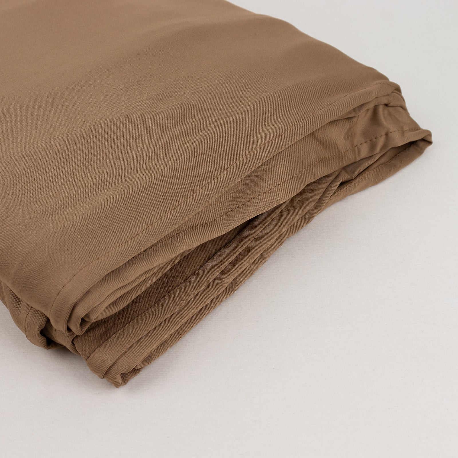 Taupe 4-way stretch spandex fabric roll, 60"x10 yards, ideal for DIY crafts.