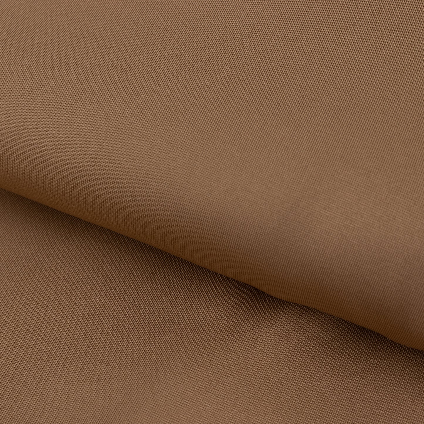 Taupe 4-way stretch spandex fabric roll, perfect for DIY crafts.