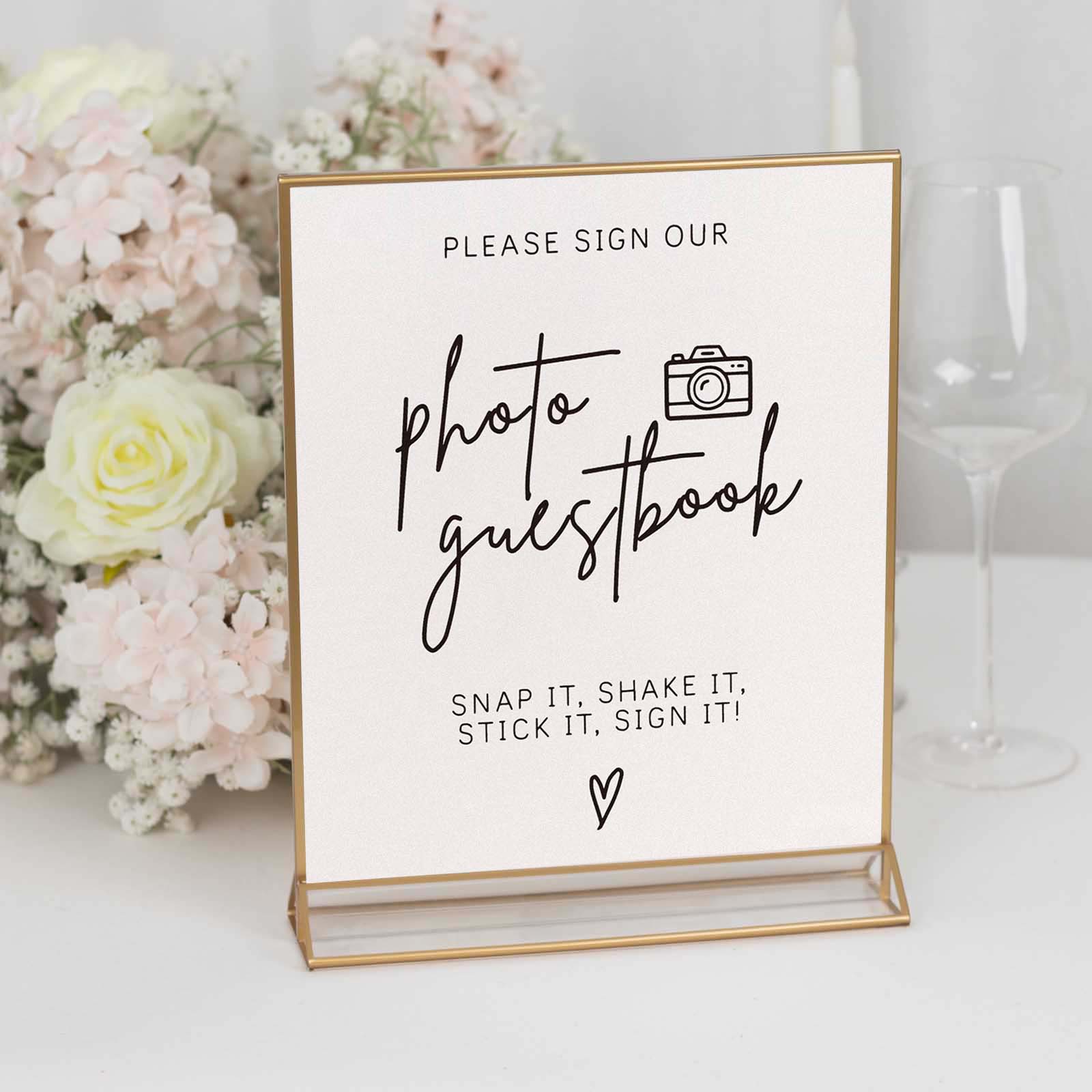 Gold freestanding table display stand with photo guestbook sign.