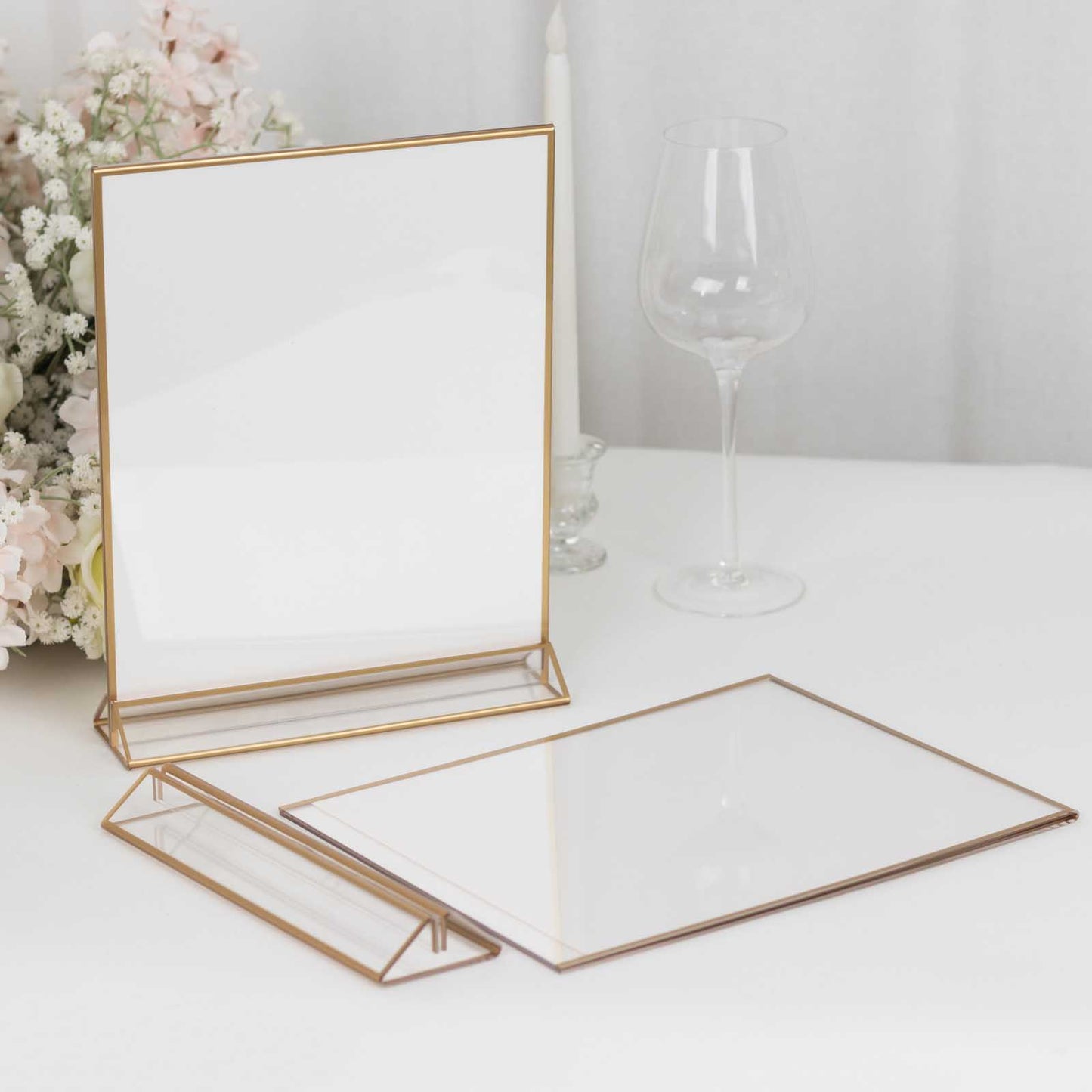 Gold acrylic freestanding table display stands for signs and menus.
