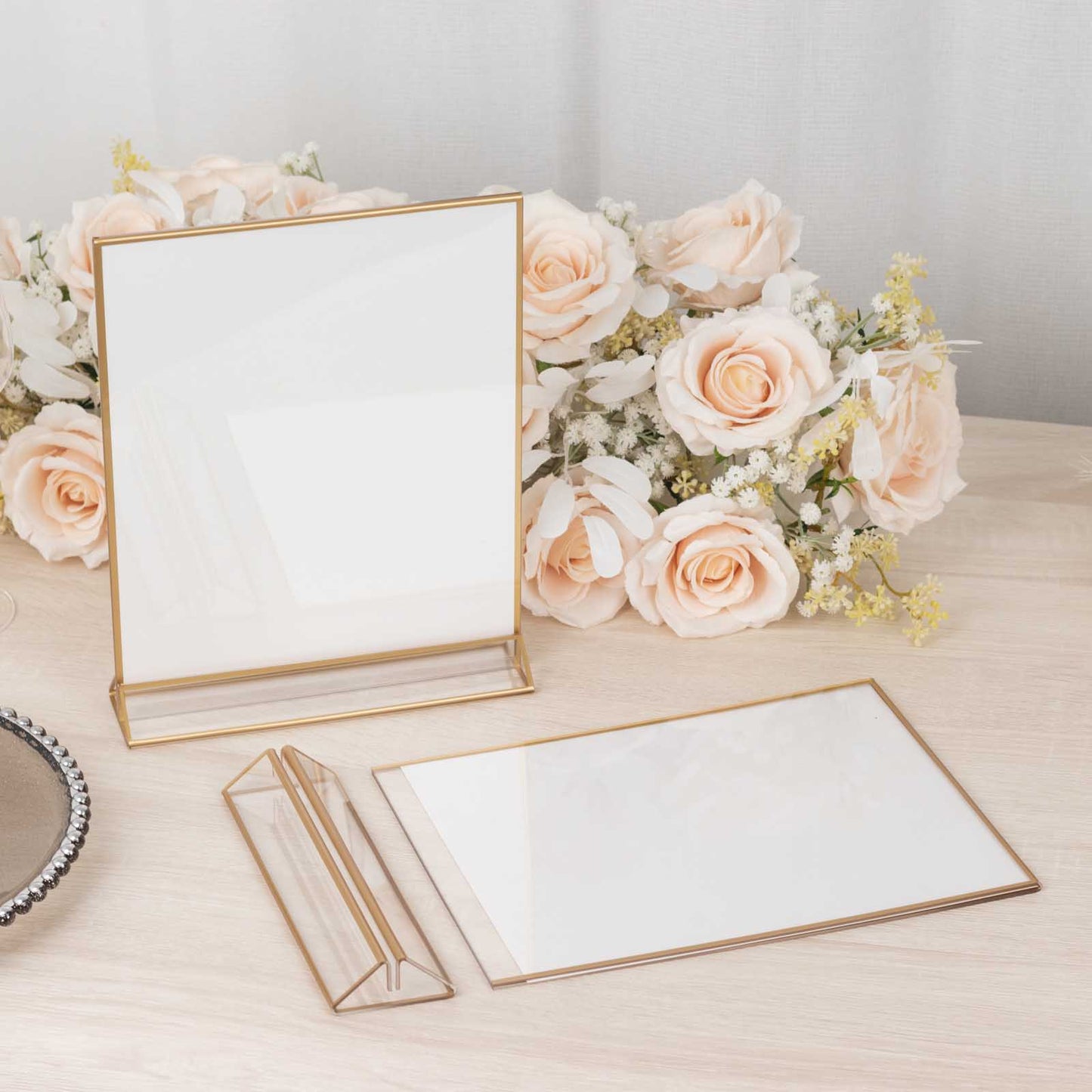 Gold acrylic freestanding table display stands with white cardboard.