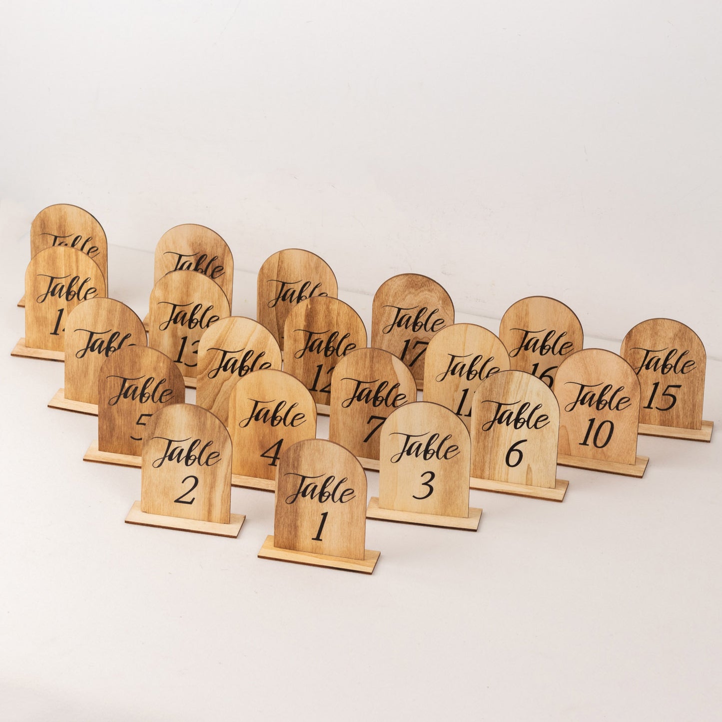 Natural wood 20-Pack 4.5" wooden arch table numbers for weddings and events.