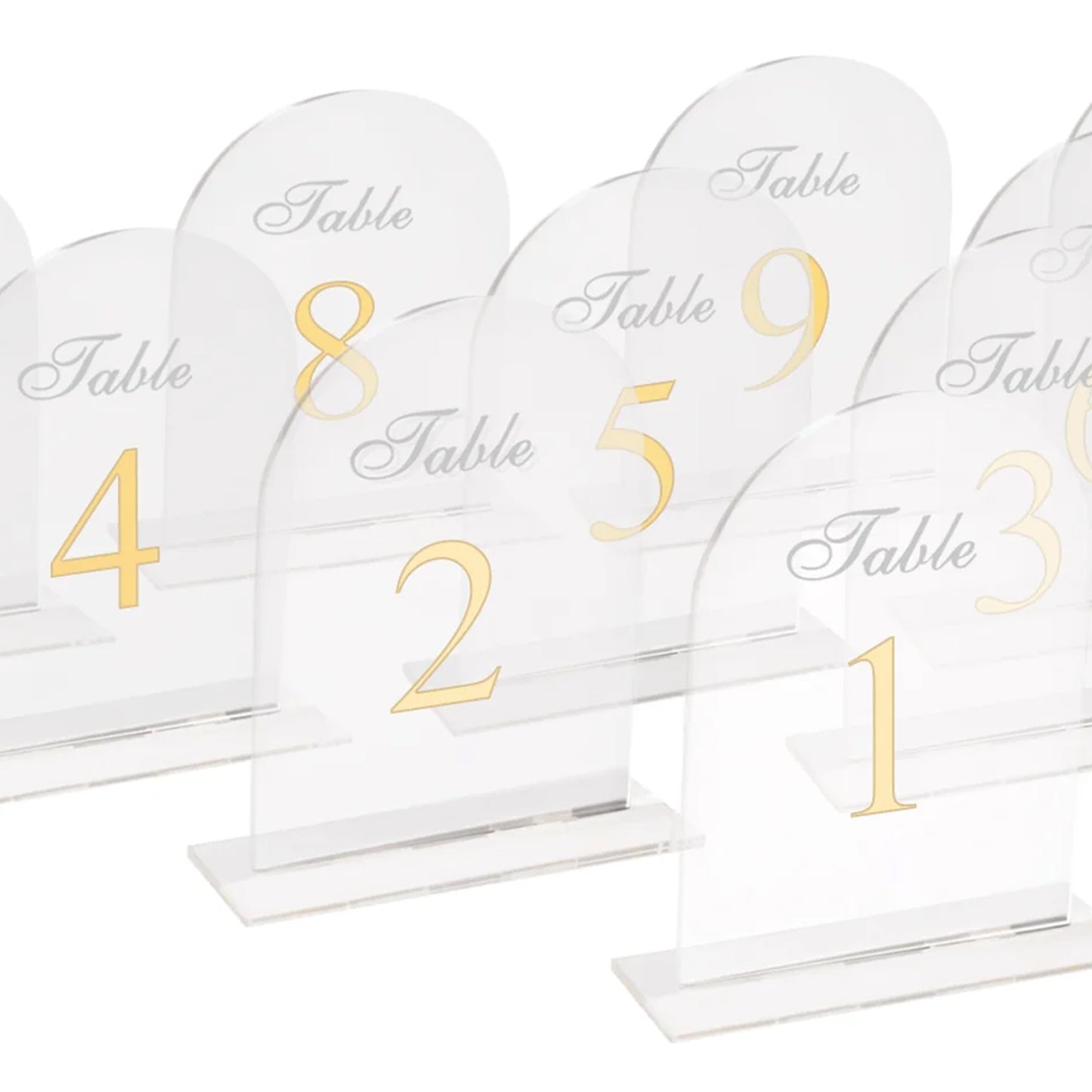 Clear arch acrylic table numbers with gold print for weddings.