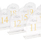 Clear arch acrylic table numbers with gold print for weddings.