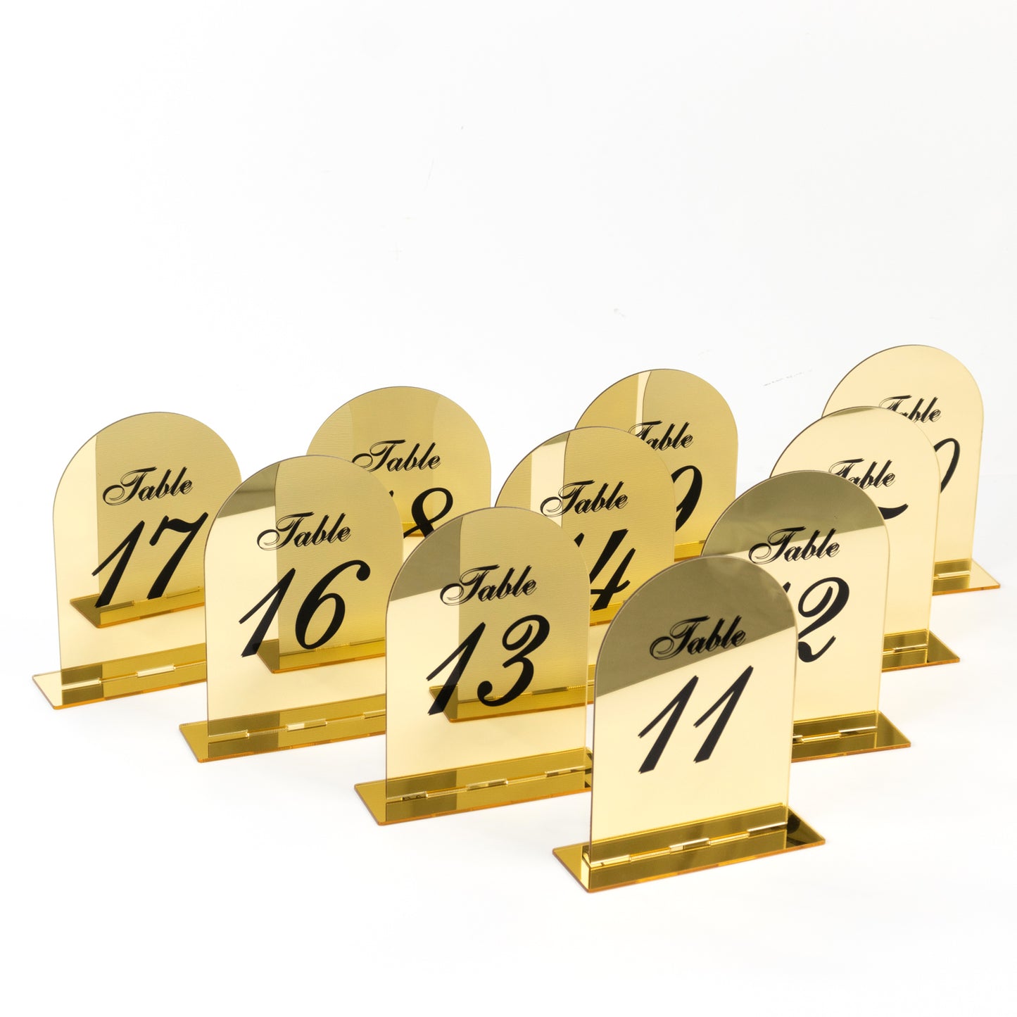 Gold mirror arch table numbers 11-20 with black print and stands.