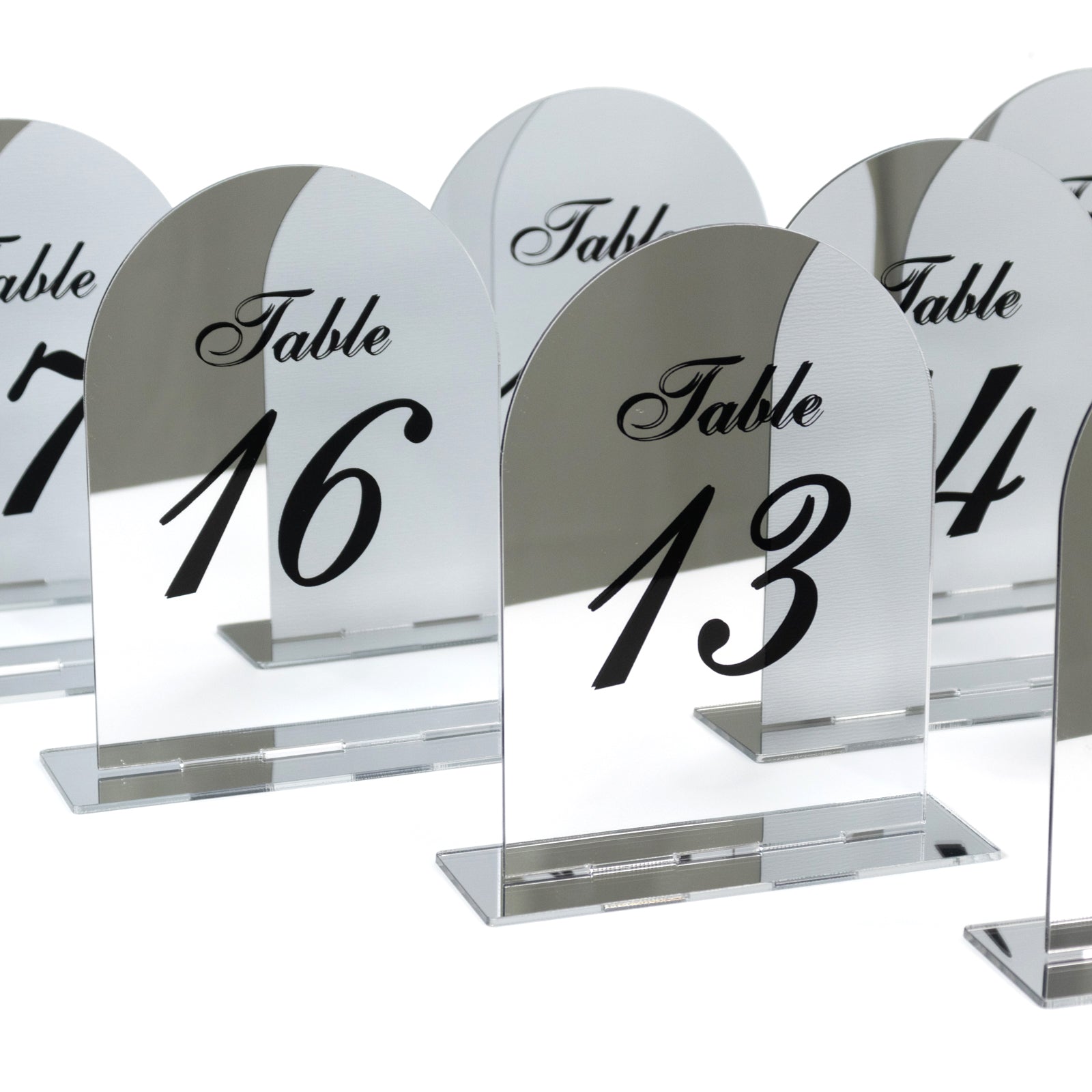 Silver mirror table numbers 11-20 with black print and stands.