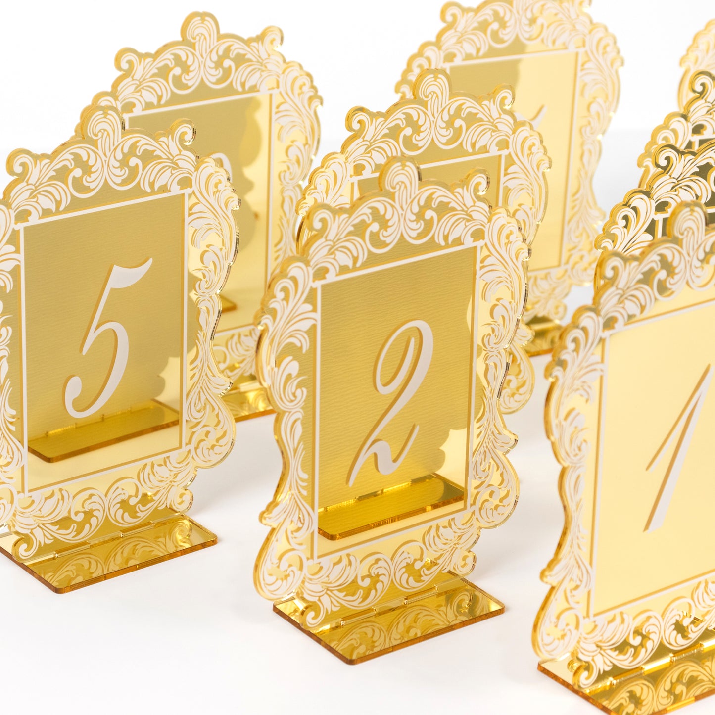Gold mirror arch acrylic table numbers with baroque lace border.