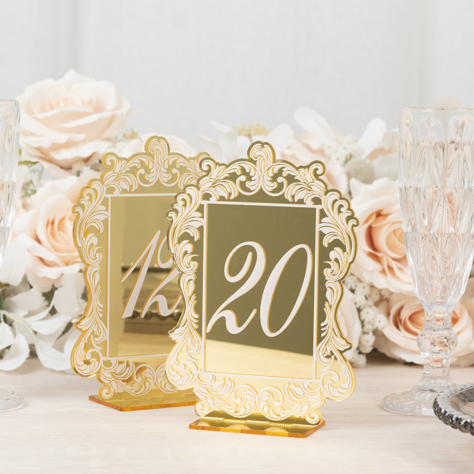 Gold mirror arch table numbers with white print and baroque lace border.