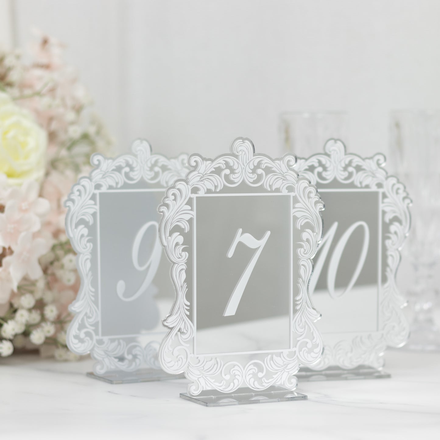 Silver mirror arch acrylic table numbers with white print and baroque lace border.