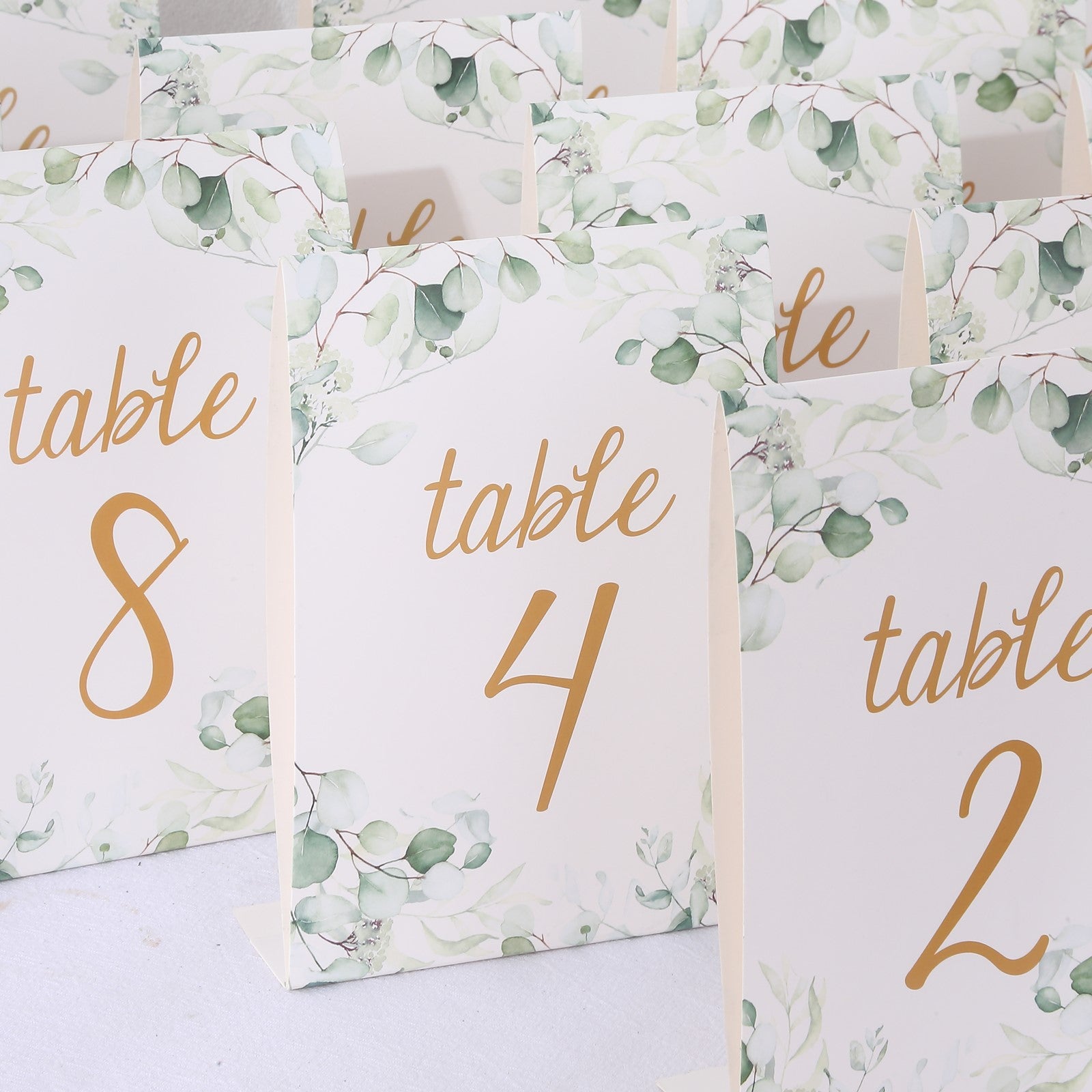 25 Pack White Green Wedding Table Numbers with Eucalyptus Leaves and Gold Foil Numbers Print, 7" Free Standing Double Sided Paper Table Sign Cards 1-25