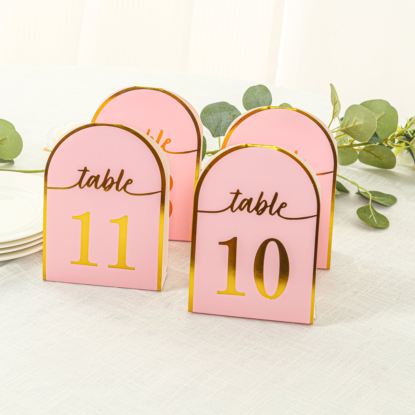 Blush pink table numbers with metallic gold foil, numbers 1-25.