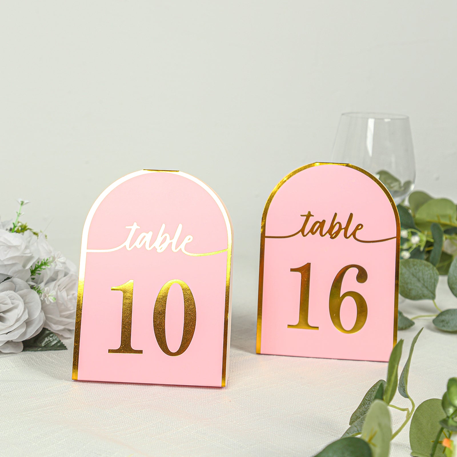 Blush pink table numbers with metallic gold foil, numbers 1-25.
