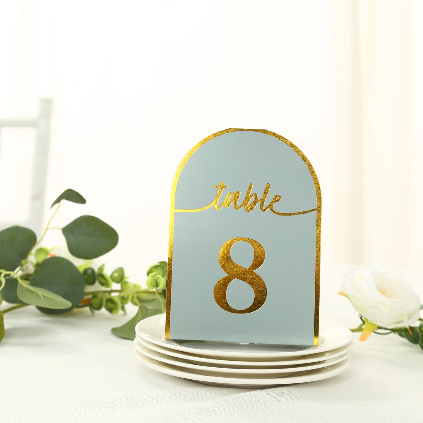 Dusty blue table number card with gold foil number 8.