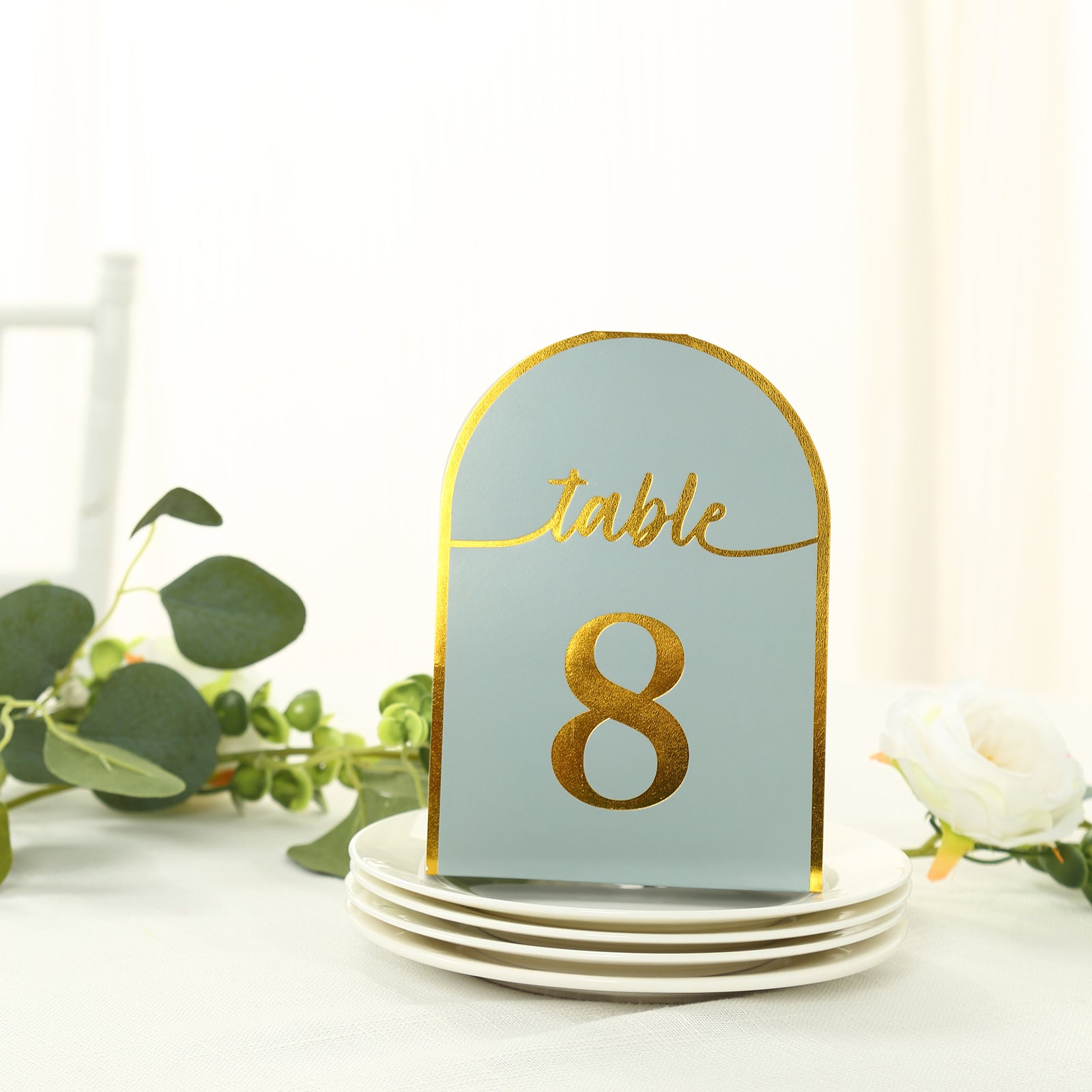 Dusty blue table number card with gold foil number 8.