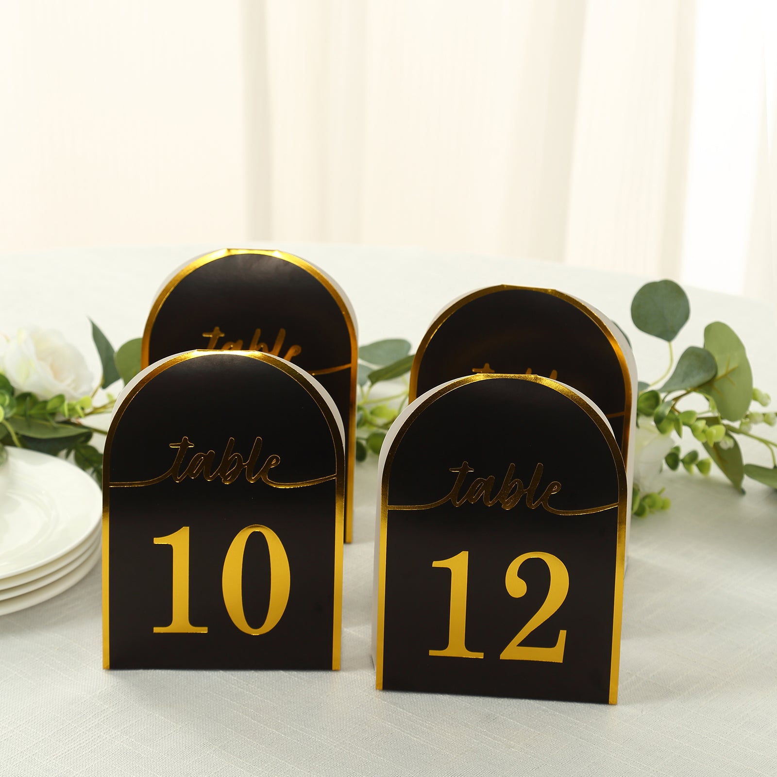 Black and gold table numbers, double-sided, for events and dining.