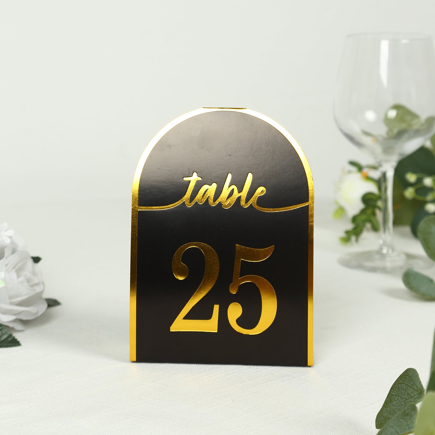 Black and gold disposable table number card, standing with number 25.