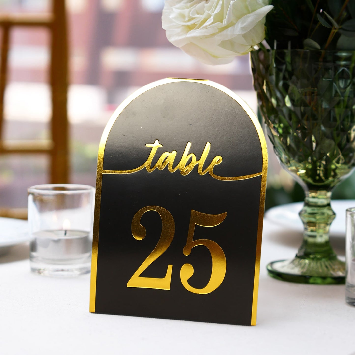Black and gold disposable table number card for events, featuring number 25.