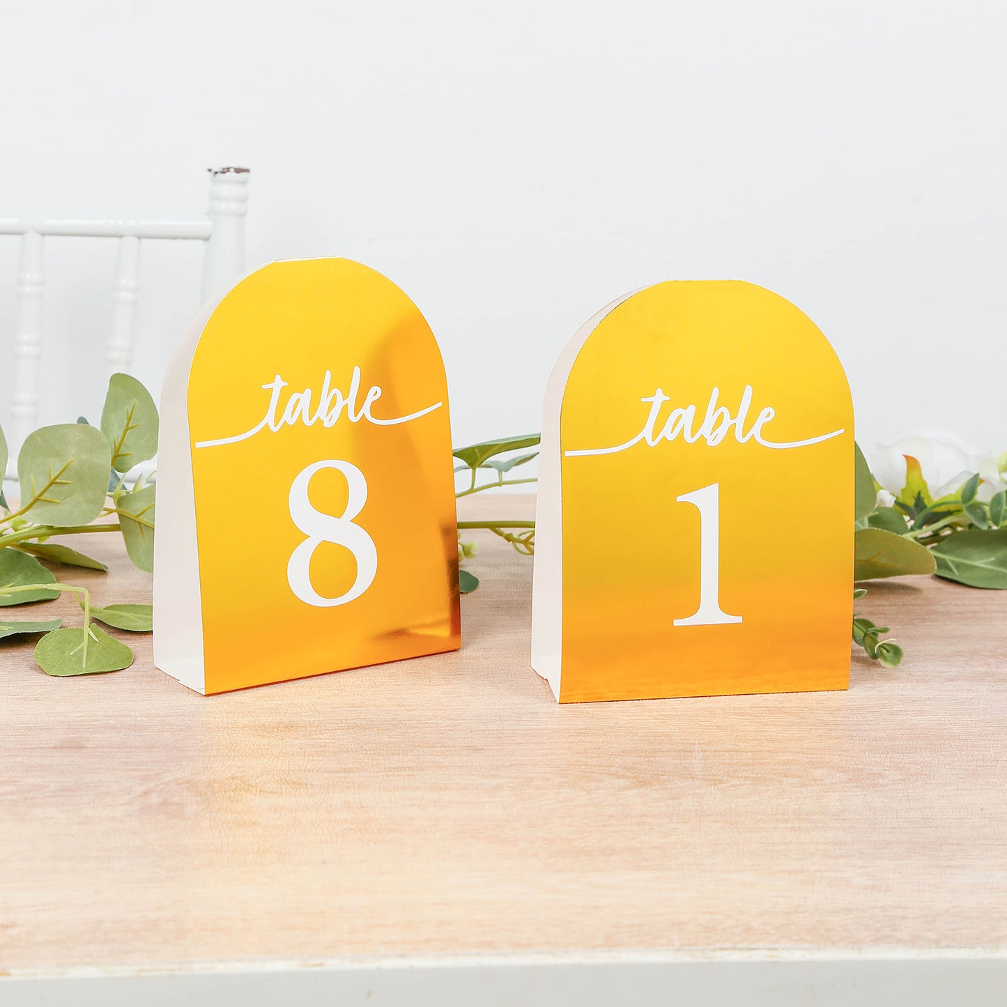 Metallic gold double-sided table numbers 1-25 with white numbers.