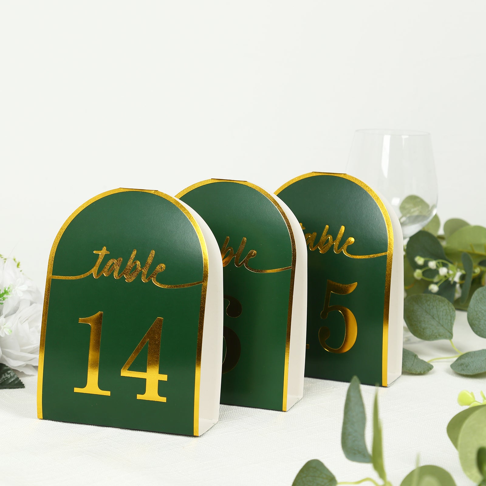 Hunter emerald green table numbers with metallic gold foil numbers 1-25.